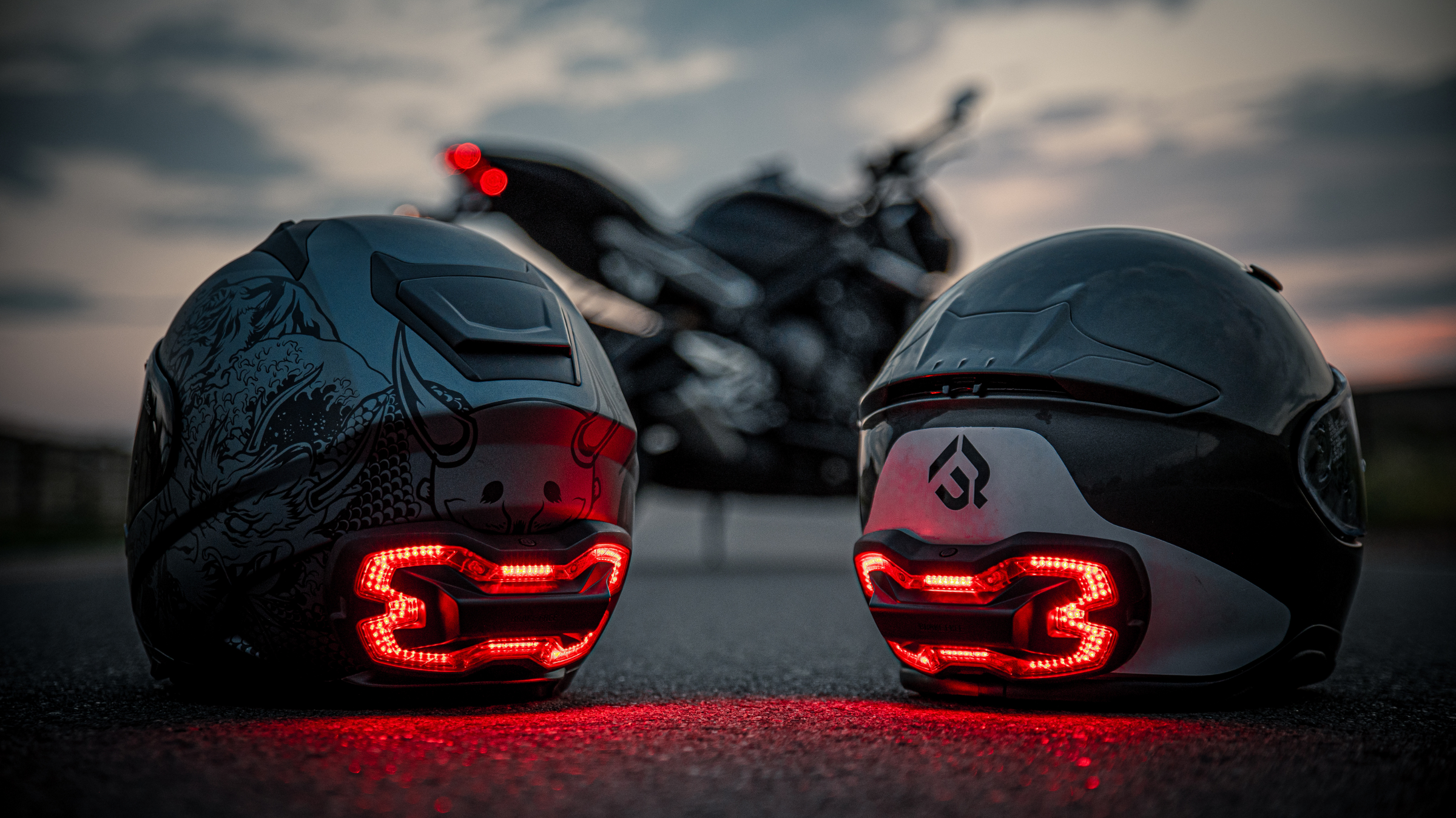Brake Free smart brake light for motorcycle helmets shown on 2 different helmets